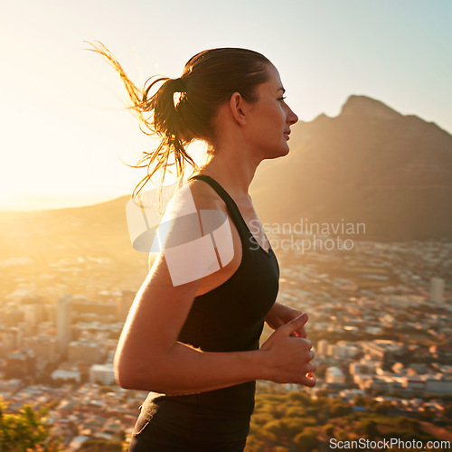 Image of Fitness, running and woman with sunset in mountain for health, wellness and strong body development. Workout, exercise and girl runner in nature for marathon training, performance and city challenge.