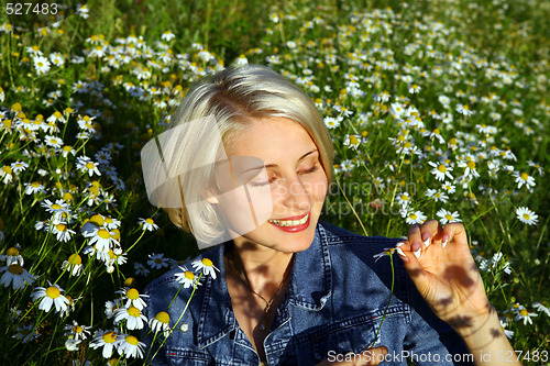 Image of Young Woman With daisy