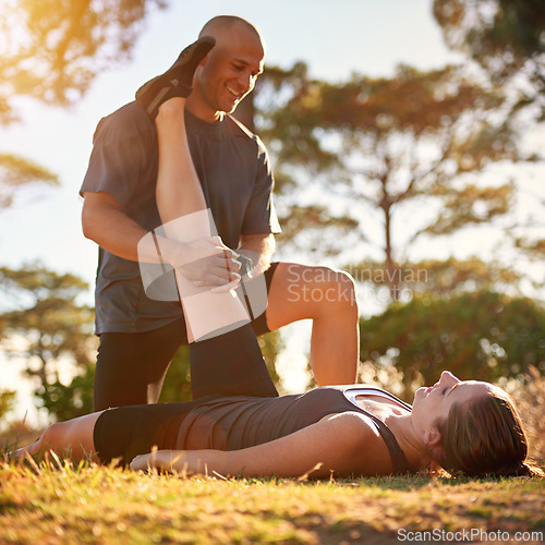 Image of Forest, stretching and woman with man for fitness, workout coach and help for healthy body. Exercise, wellness and girl athlete with personal trainer in muscle warm up for outdoor training in morning