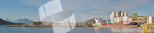 Image of Industrial, landscape and ship on the ocean for transportation, factory and manufacturing. Panoramic view, boat or yacht for production with industry and natural background with nautical vessel