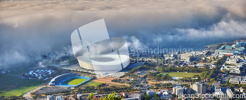 Image of Cityscape, skyline and Cape Town in South Africa for travel, journey and adventure in nature. Landscape, sea and holiday or vacation for freedom, stadium and table mountain as location for tourists
