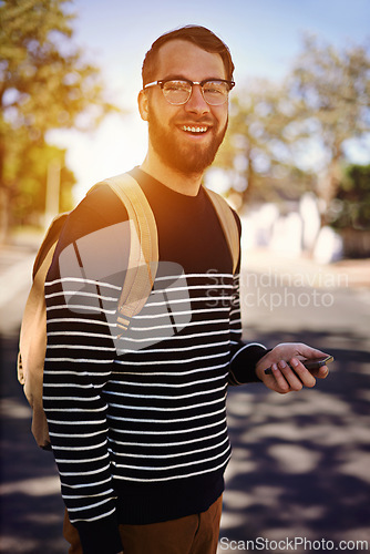 Image of Man, smile and city with mobile phone in hand for social media or fashion for trend or browsing outdoor. Student, intern or geek and attractive person with confidence in street for hipster and style