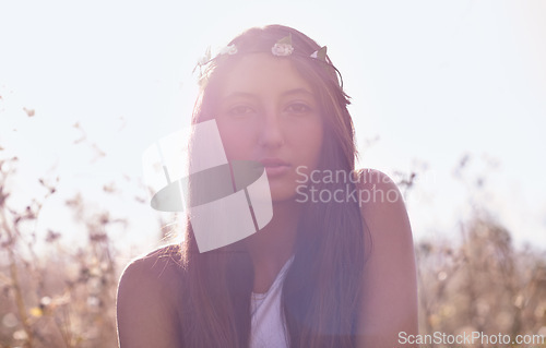 Image of Woman, portrait and hipster with headband in wheat field or nature for outdoor summer or sunshine. Face of young female person, teenager or brunette in relax for season with lens flare in countryside