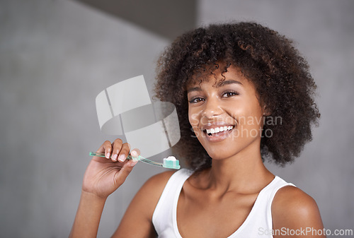 Image of Black woman, smile in portrait and toothbrush for teeth whitening in bathroom, dental health and self care for fresh breathe. Orthodontics, oral hygiene and morning routine with toothpaste at home