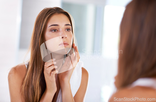 Image of Woman, mirror and skincare beauty in bathroom for cosmetic facial for treatment, natural or washing. Female person, hand and reflection in home for dermatology glow for heath, self care or wellness