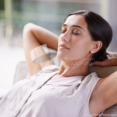 Image of Face, relax and sleep with woman on sofa in living room of home for break, nap or rest on weekend. Calm, peace and quiet with person lying eyes closed in apartment for Sunday afternoon dreaming