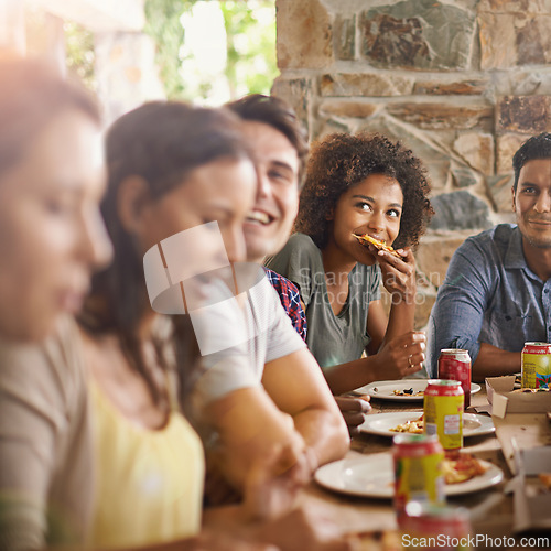 Image of Friends, woman and eating of pizza in home with happiness, soda and social gathering for bonding in dining room. Men, group and fast food with smile, drinks and diversity at table in lounge of house