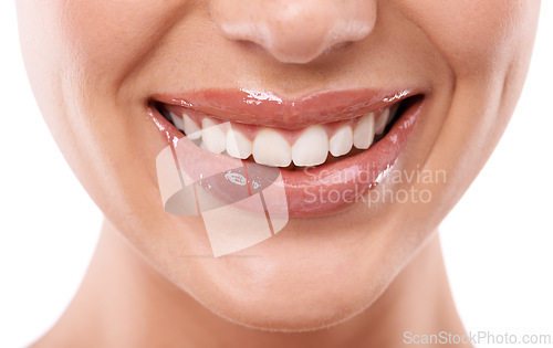 Image of Closeup, lips and teeth with woman for beauty, makeup with gloss or oil for hydration and dental health in studio. Lip care, cosmetics and orthodontics, moisturizing and mouth on white background