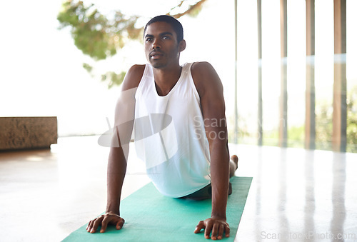 Image of Fitness, home and black man do yoga in morning for wellness, flexibility and balance for healthy body. Training, pilates and person on sports mat for stretching, workout and exercise in living room