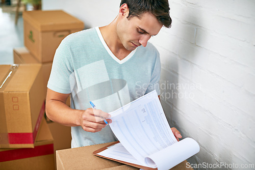 Image of Man, boxes and home with clipboard for moving, delivery and documentation for logistics, check and invoice. Person, cardboard and package with paperwork for service, signature or stock in new house