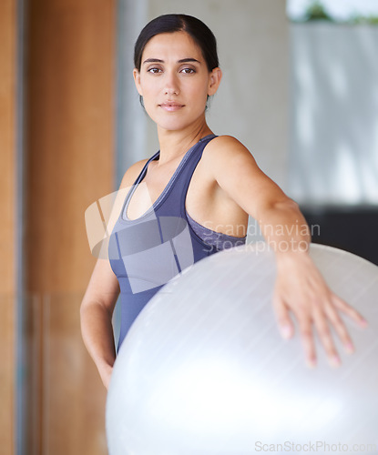 Image of Woman, portrait and exercise with ball for workout, training or health and wellness at home. Face of active female person or young yogi with gym equipment for pilates, fitness or warm up at the house