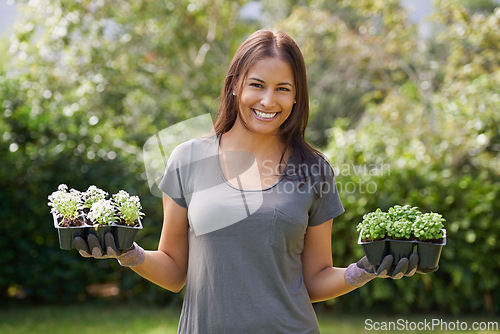 Image of Happy, portrait and woman in a garden with plant, sprout or checking leaf growth outdoor. Backyard, sustainability and face of female person gardening outside for lawn, grass or asylum seedling soil
