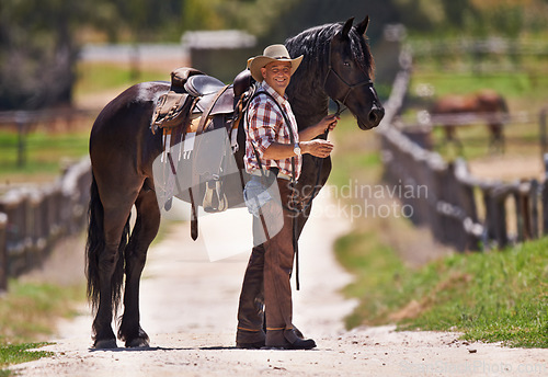 Image of Cowboy, horse and happy in portrait in nature and together on western ranch in country. Trainer, face or smile by strong stallion of american quarter thoroughbred or pride for healthy animal on farm