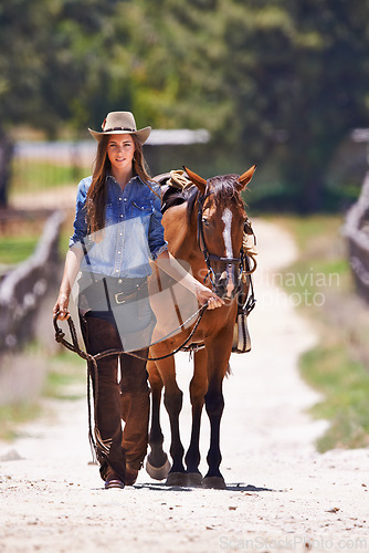 Image of Cowboy, horse or happy woman in portrait or walk together on western ranch in country. Trainer, face or smile by strong stallion of american quarter thoroughbred or pride for healthy animal on farm