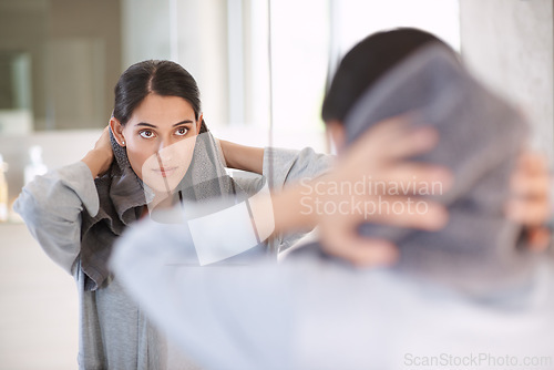 Image of Woman, towel and hair after wash, shower and bathroom for self care and beauty and getting ready. Female person, haircare and mirror in restroom, rag and reflection for cosmetics and home spa