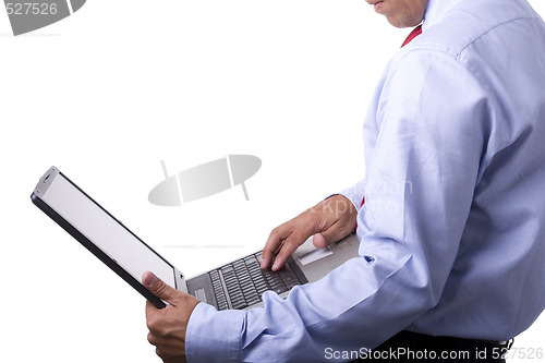 Image of working his laptop