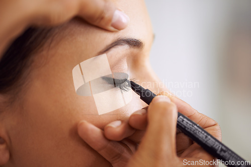Image of Woman, makeup and eyeliner with mascara pencil for beauty, cosmetics or art at salon or spa. Closeup of female person or stylist applying shadow, contour or color for facial eye treatment or glamour