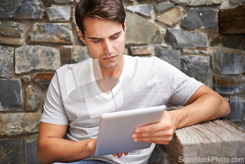 Image of Tablet, search and man at a restaurant outdoor with website, menu or checking food, order or options. Digital, app and male person at a cafe with customer experience survey, review or online feedback