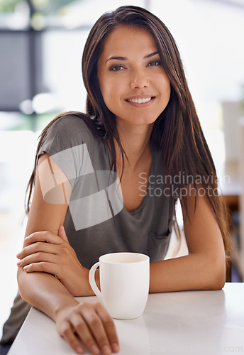 Image of Portrait, coffee and smile with woman in kitchen of home to relax in morning or on weekend time off. Face, relax and mug with happy young person drinking tea in apartment for peace or wellness