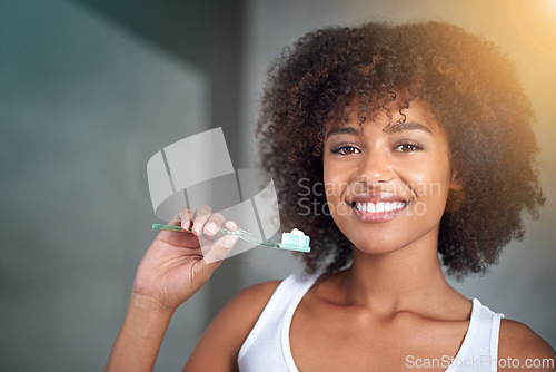 Image of Black woman in portrait, toothpaste and toothbrush for teeth whitening in bathroom, dental health and self care for fresh breathe. Orthodontics, oral hygiene and morning routine with habit at home