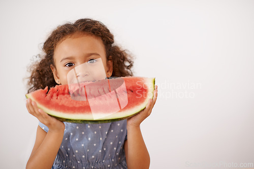 Image of Eyes, portrait or girl with watermelon in studio for healthy, diet or wellness on grey background. Fruit, mockup or kid model face with gut health, nutrition or organic snack for digestion support