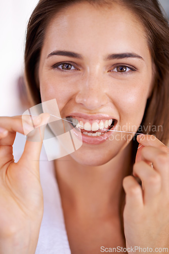Image of Clean, dental and portrait of woman with floss for health, wellness and grooming routine for hygiene. Oral care, happy and female person with dentistry tool for teeth or mouth treatment in bathroom.