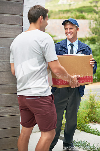 Image of Courier man, customer and box for service at house reading and happy for delivery, shipping and outdoor. Person, cardboard and package with paperwork for giving, distribution or stock in supply chain