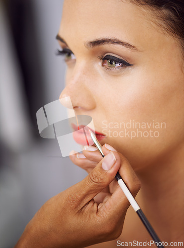 Image of Face, woman and makeup brush on lips for beauty with hands, application of cosmetics product and glamour. Person, mouth and color lipstick for skincare, aesthetic makeover and cosmetology at salon