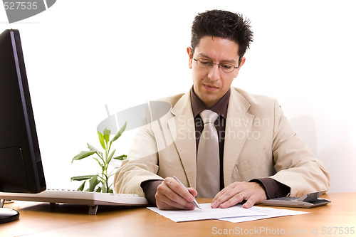 Image of businessman working at his office