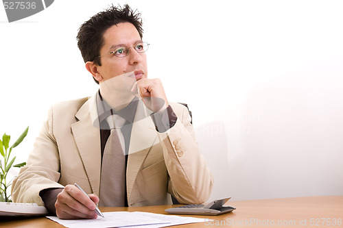 Image of businessman working at his office 