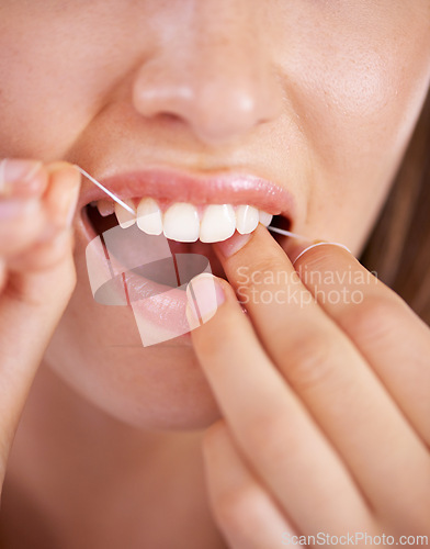 Image of Floss, dental and closeup of woman teeth with health, wellness and clean routine for hygiene. Oral care, grooming and zoom of female person with dentistry tool for mouth treatment for fresh breath.