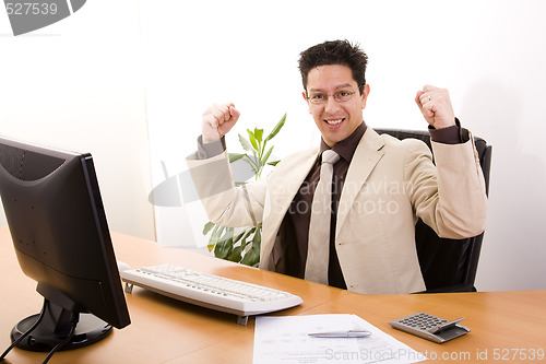 Image of businessman showing his success