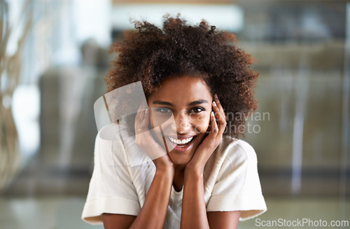 Image of Smile, African woman person and happy in home lounge, positive and joyful in living room. Hands, laugh and positive expression on face of female person, afro and comfort or relax at house on weekend