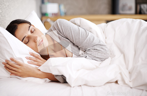 Image of Sleeping, peace and woman relax in a bed with comfort, dreaming or resting at home. Sleep, soft and female person in a bedroom for vacation, holiday or day off nap, recovery or quiet snooze in house