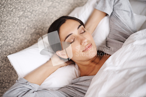 Image of Peace, relax and woman sleeping in a bed with comfort, dreaming or resting at home. Sleep, top view or female person in bedroom for vacation, holiday or day off nap, recovery or calm snooze in house