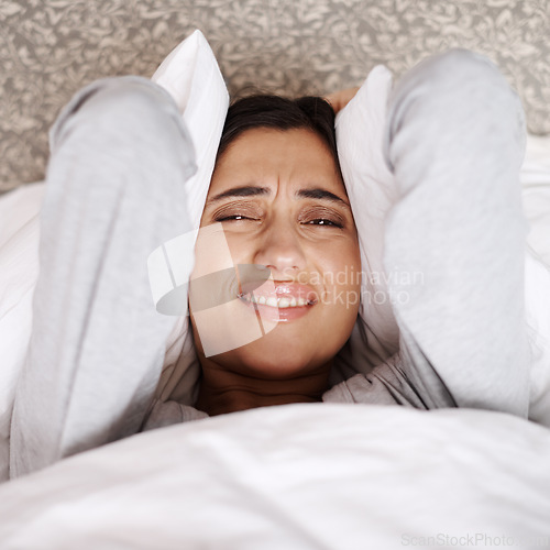 Image of Sleeping, stress and portrait of woman in bed frustrated by insomnia, nightmare or terror at home from above. Anxiety, headache and face of female person in bedroom with pillow, noise or overthinking