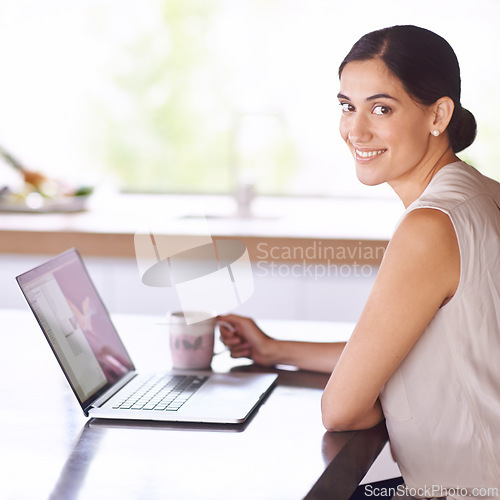 Image of Woman, portrait and laptop in kitchen for work at home, online or browse website for information on product sales. Female person, computer and internet for search for feedback on targets and project.