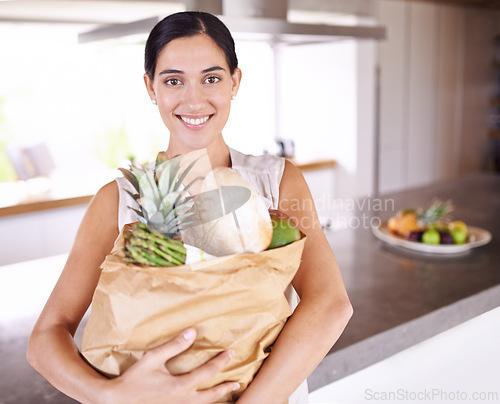 Image of Groceries, bag and portrait of woman with healthy food in kitchen for nutrition, diet or cooking in home. Happy, wellness and person with a smile for fruits, vegetables and eating with balance