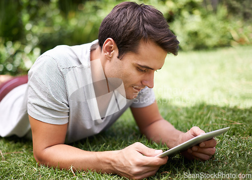 Image of Man, tablet and garden reading or relax connection fr browsing social media on weekend, subscription or online. Male person, backyard and nature rest with ebook for entertainment, search or internet