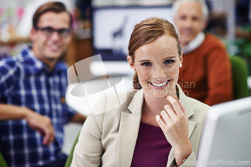 Image of Businesswoman, portrait and research on computer in office, online and check email for networking. Happy female person, coworking space and project or proposal, report and website at creative agency