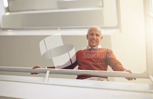 Image of Low angle, business and portrait with man, stairs and creative agency with professional and PR consultant. Face, mature person and employee with happiness and entrepreneur with steps and startup