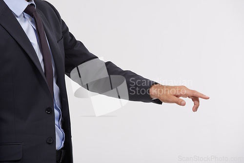 Image of Businessman, studio and hand pointing with interface for touch, UX or UI on a gray background. Closeup of young man, user or employee with interaction for virtual technology, push or click on mockup