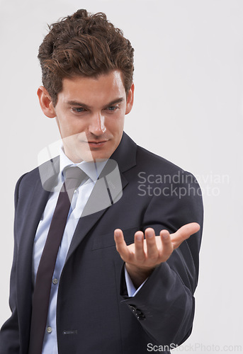 Image of Businessman, palm and hand with interaction for virtual display or hologram on a white studio background. Isolated young man, user or business employee showing gesture sign, symbol or 3D technology