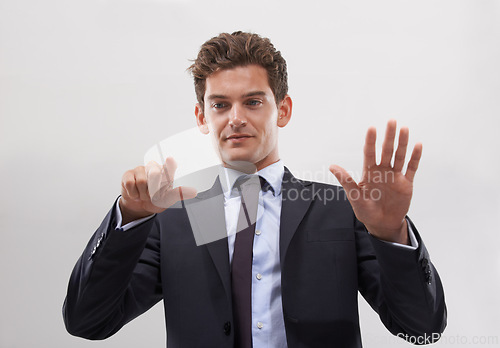 Image of Business, man and confident with a digital interface in studio on white background for company research and ideas. Male person, technology and click for user experience with digital transformation.