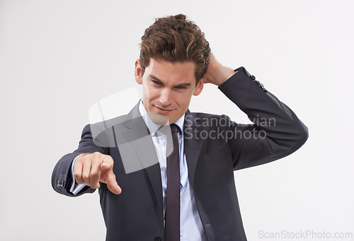 Image of Businessman, confused and hand pointing with digital interface, UI or display on a white background. Young man, user or employee in doubt or interaction on virtual technology, push or click on mockup