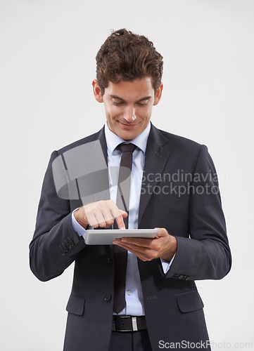 Image of Business, typing and man holding a tablet, communication or connection on white studio background. Web, person or model with tech, internet and social media with email notification and digital app