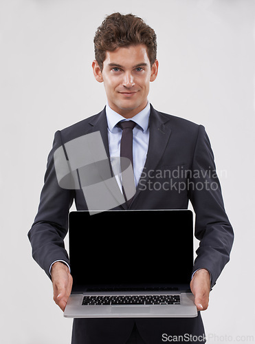 Image of Portrait, screen and man with a laptop, connection and professional on white studio background. Face, person and model with tech, internet or employee with presentation and computer with website info