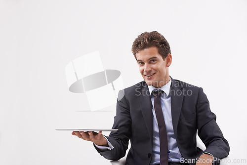 Image of Portrait, presentation and man holding a tablet, communication or digital app on white studio background. Face, person or model with technology, internet or social media with email, showing and smile