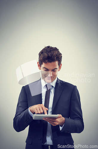 Image of Tablet, research and business man scroll in studio isolated on gray background mockup space for communication. Digital technology, trader and happy professional, networking or reading email on app