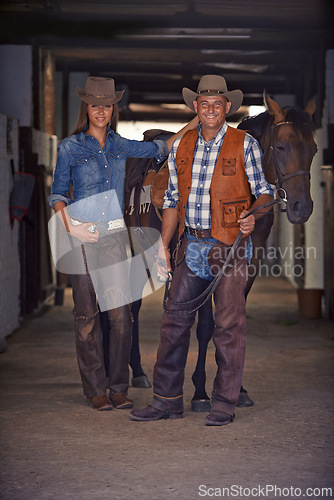 Image of Portrait, horse and couple in stable at farm in rural countryside for animal care in Texas. Smile, confident and full body of young man and woman with cowboy hats for fashion with stallion on ranch.